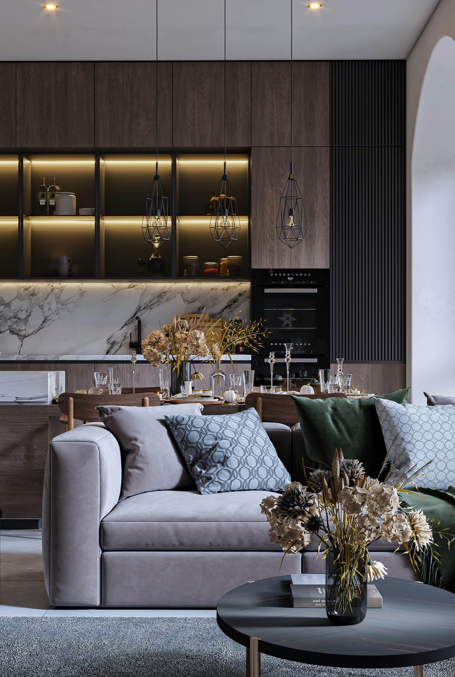 A softly lit lounge with a deep sofa and dark timber shelving